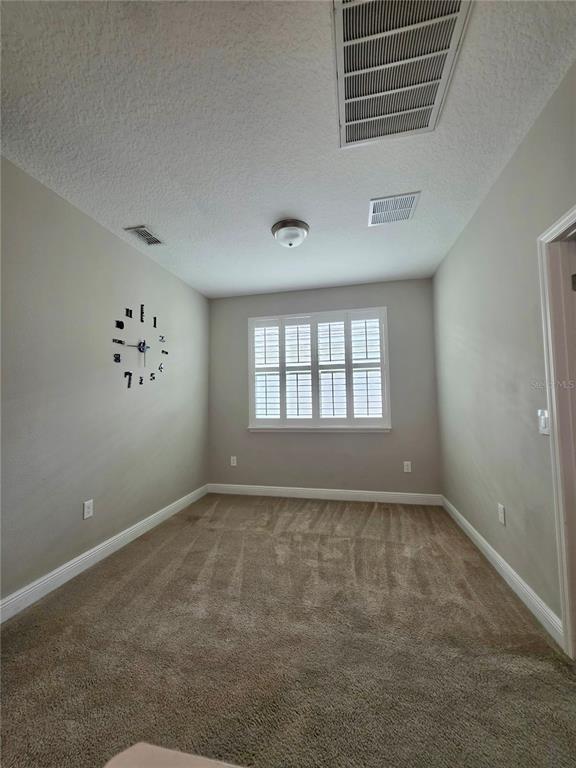 8582 Powder Ridge Trail Windermere, FL 34786 - Photo 15 of 50 a view of an empty room with a window