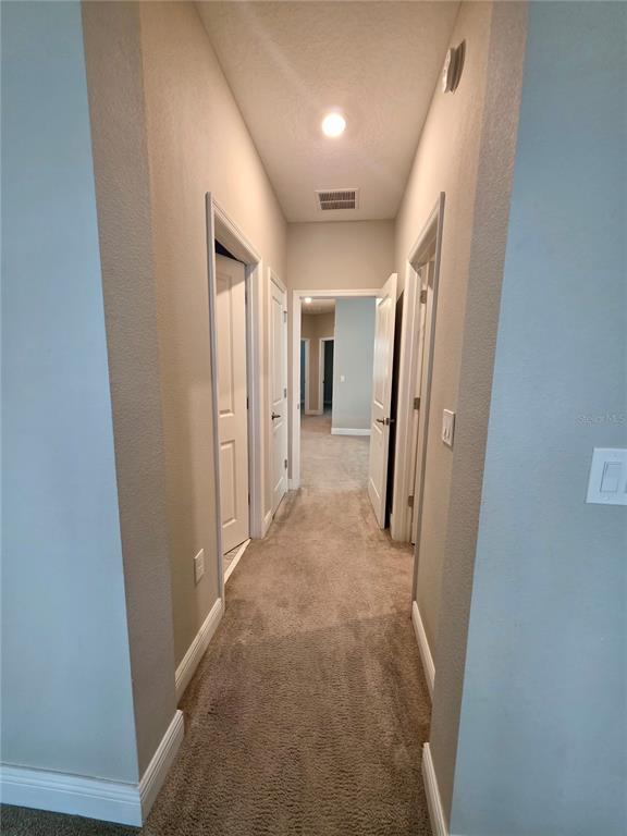 8582 Powder Ridge Trail Windermere, FL 34786 - Photo 16 of 50 a view of a hallway