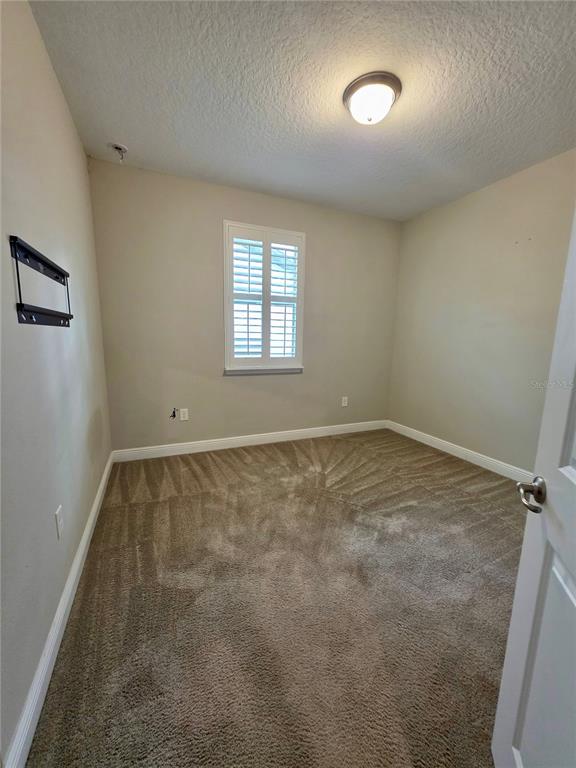 8582 Powder Ridge Trail Windermere, FL 34786 - Photo 17 of 50 an empty room with a window
