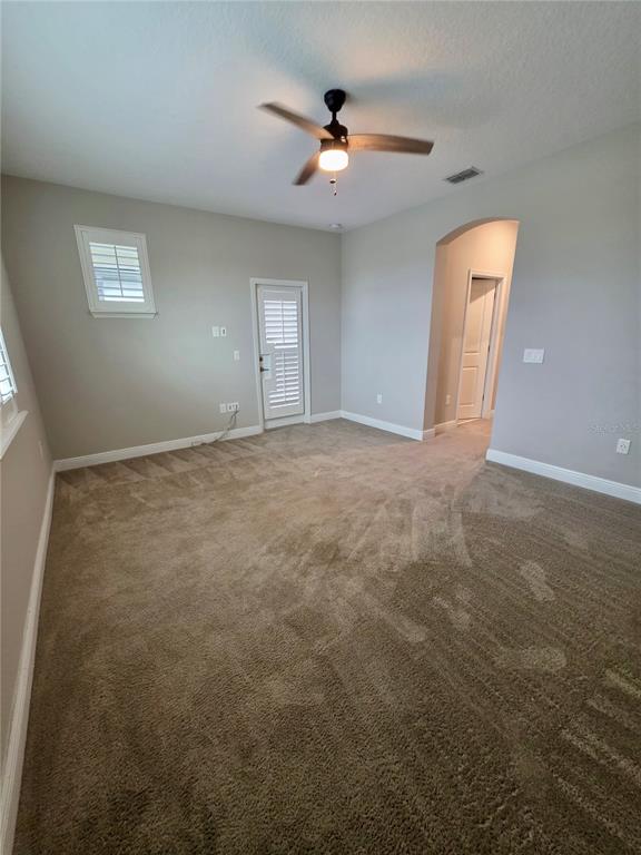 8582 Powder Ridge Trail Windermere, FL 34786 - Photo 21 of 50 a view of an empty room with a window
