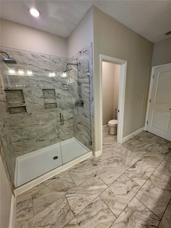 8582 Powder Ridge Trail Windermere, FL 34786 - Photo 28 of 50 a bathroom with a shower