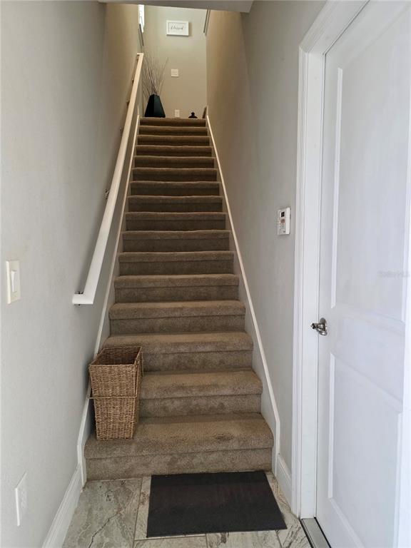8582 Powder Ridge Trail Windermere, FL 34786 - Photo 36 of 50 a view of entryway and hall with wooden floor