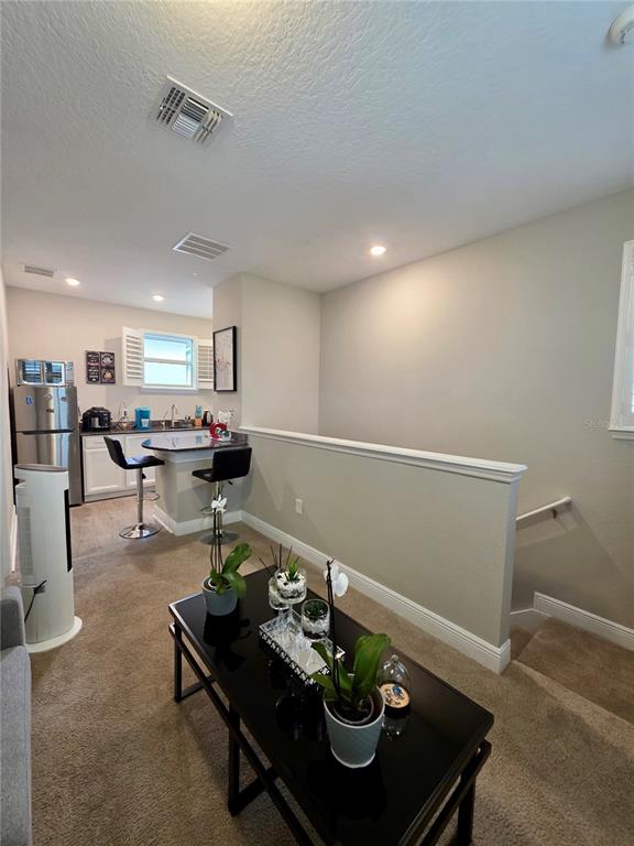8582 Powder Ridge Trail Windermere, FL 34786 - Photo 39 of 50 a living room with furniture and kitchen view