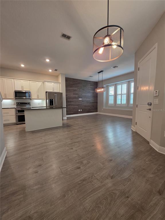 8582 Powder Ridge Trail Windermere, FL 34786 - Photo 4 of 50 a view of a kitchen with a sink and chandelier