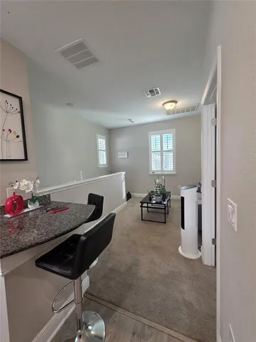 a bathroom with a sink a toilet a mirror and shower