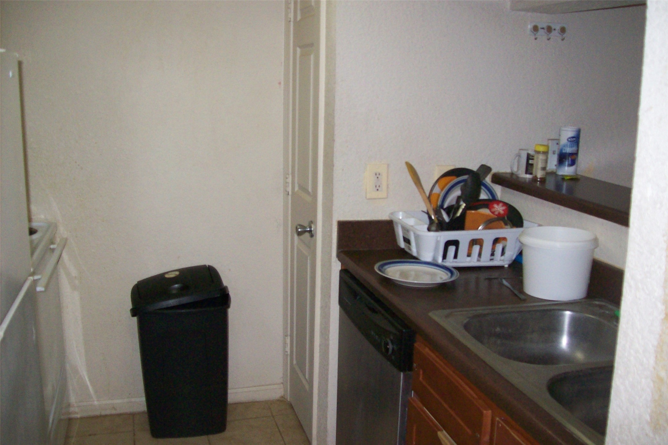8100 Creekbend Drive, Unit 149 Houston, TX 77071 - Photo 3 of 8 a kitchen with a sink and a stove with wooden floor
