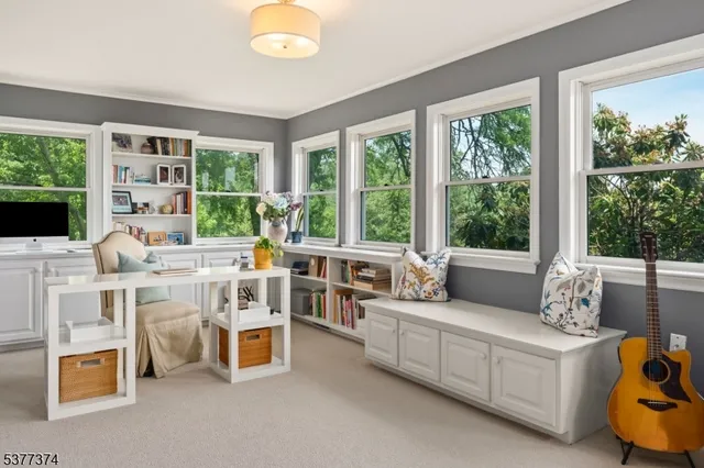 a bedroom with a bed couch and window