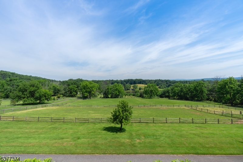 23 Spring Hill Road Annandale, NJ 08801 - Photo 16 of 48 a view of a golf course with a lake