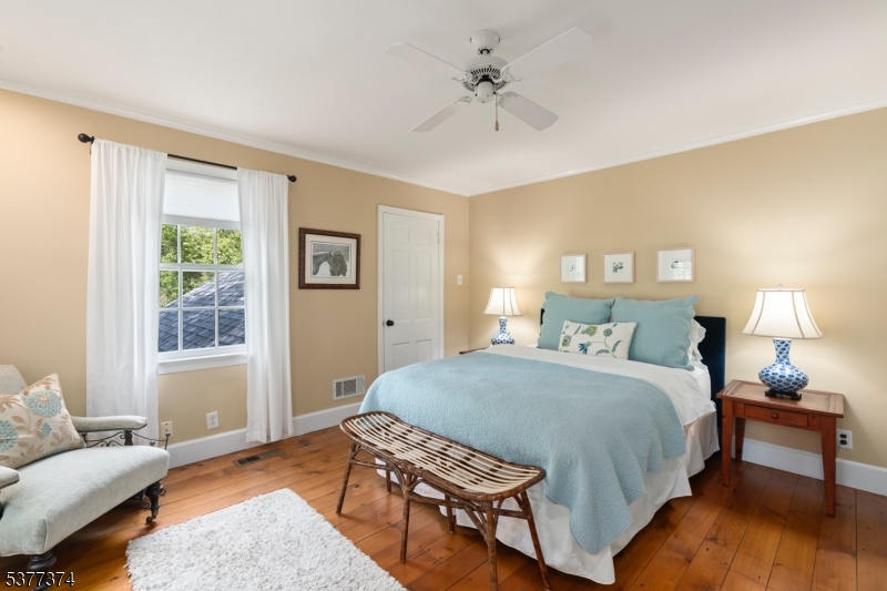 23 Spring Hill Road Annandale, NJ 08801 - Photo 25 of 48 a bedroom with a bed and a couch