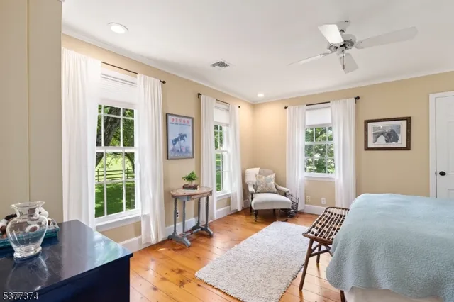 a front view of a house with yard and green space