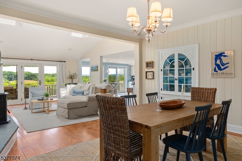 23 Spring Hill Road Annandale, NJ 08801 - Photo 9 of 48 a view of a dining room with furniture a chandelier and large windows