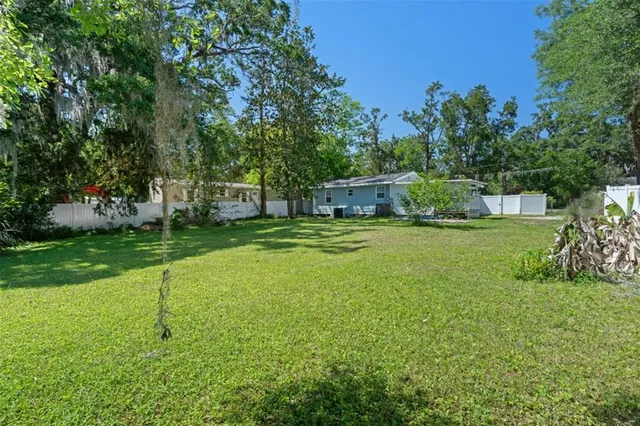 a view of a house with a big yard