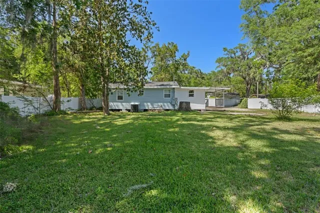 a view of a house with a big yard