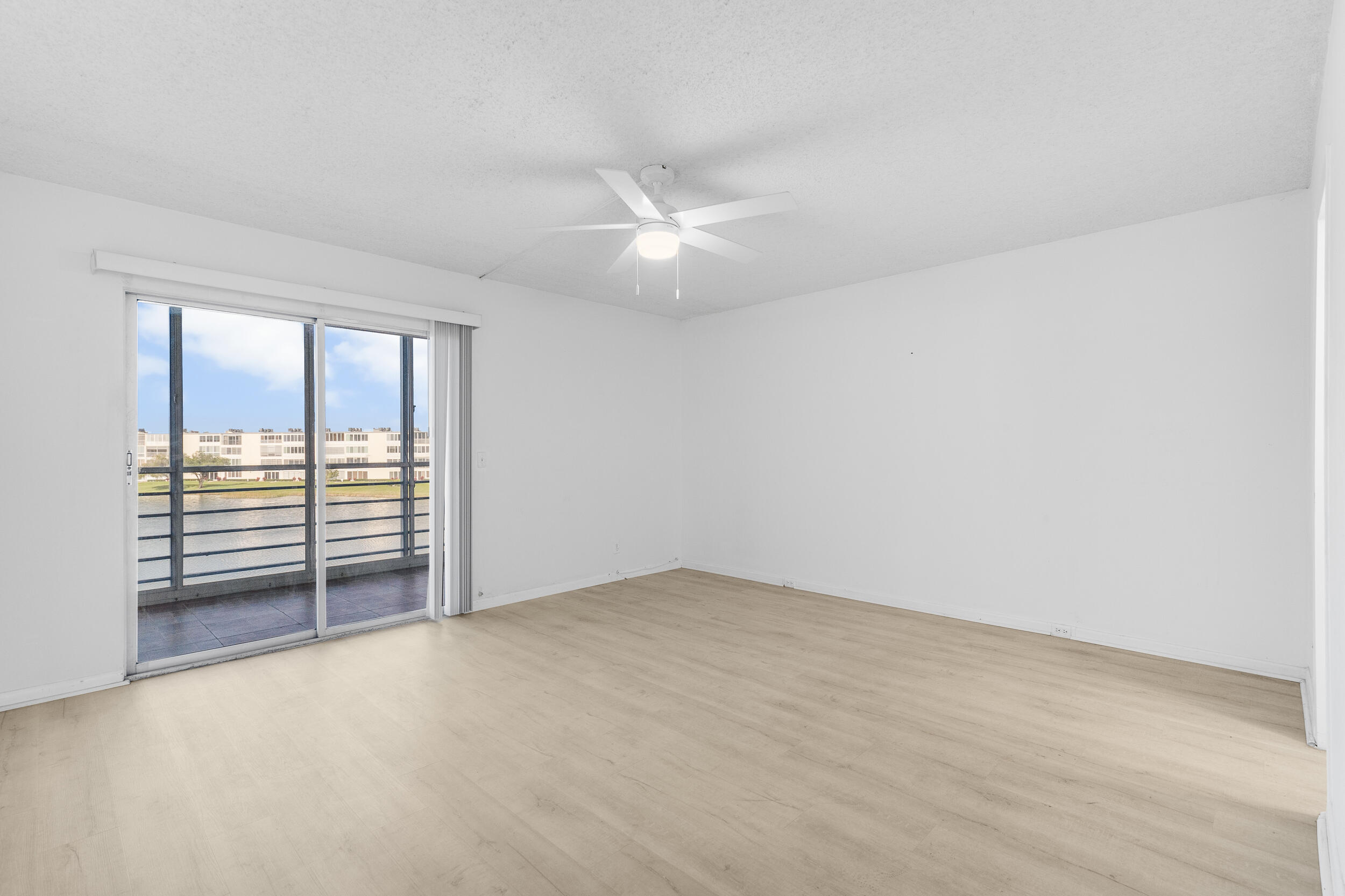 3089 Cornwall East, Unit E Boca Raton, FL 33434 - Photo 17 of 39 a view of an empty room with a window