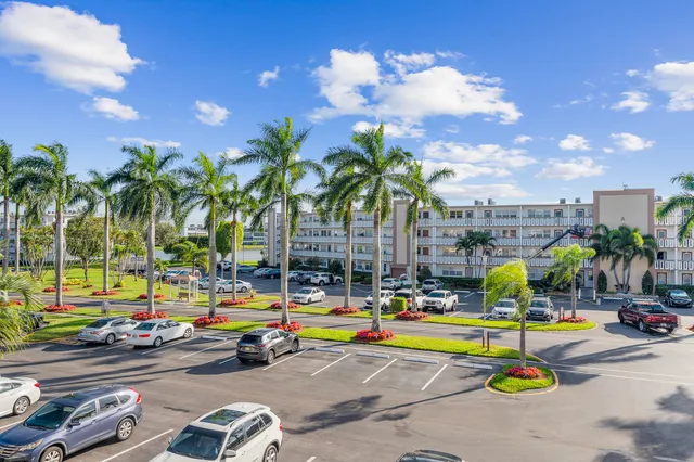 an empty room with a ceiling fan and a window