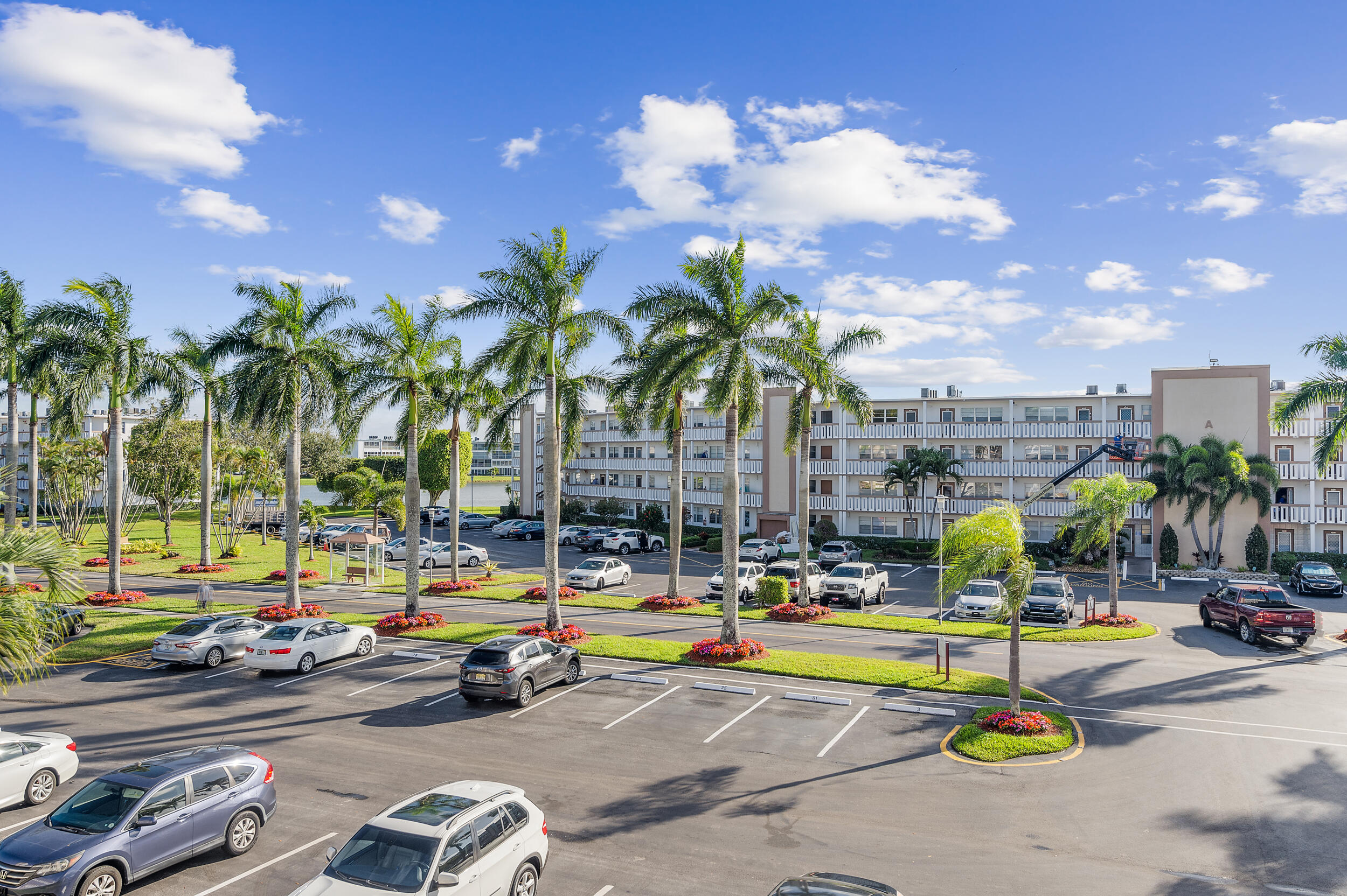 3089 Cornwall East, Unit E Boca Raton, FL 33434 - Photo 5 of 39 a view of outdoor space with swimming pool and seating
