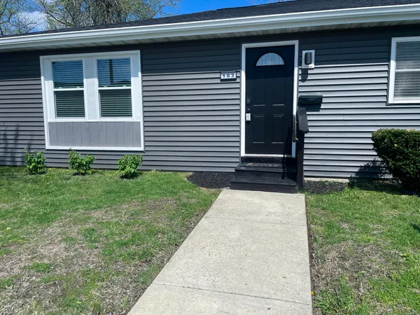 a view of a house with a yard