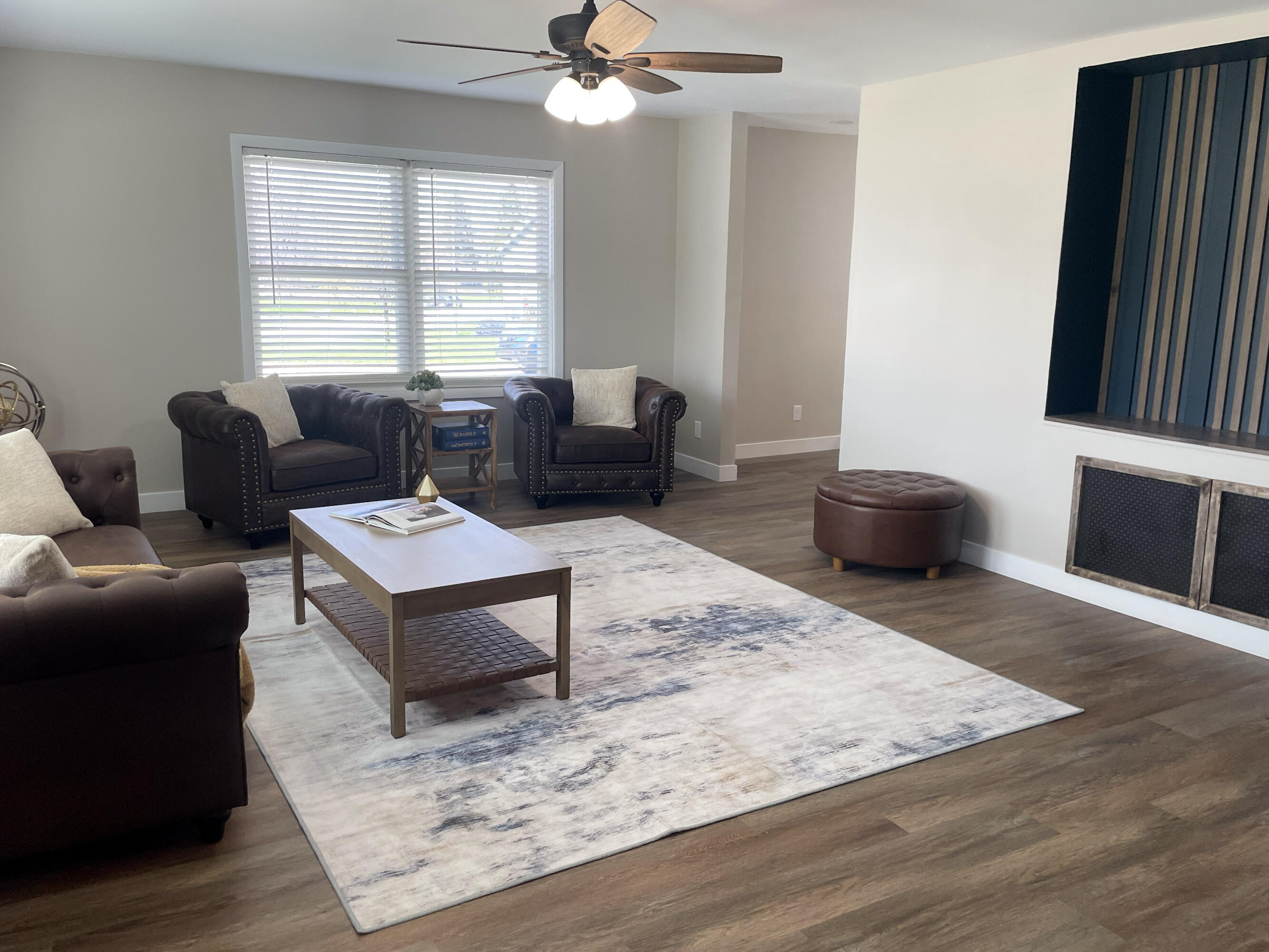 103 Michigan Street Chesterton, IN 46304 - Photo 14 of 46 a living room with furniture a window and a flat screen tv