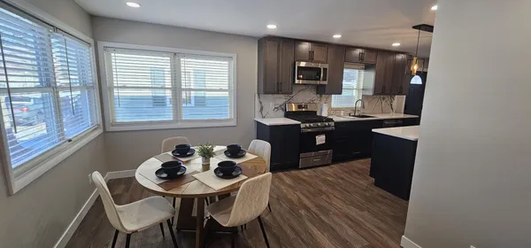 a view of a dining room with furniture and window