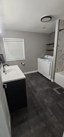 a utility room with dryer and washer