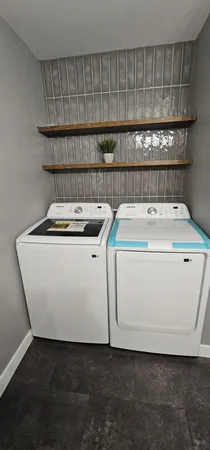 a utility room with washer and dryer