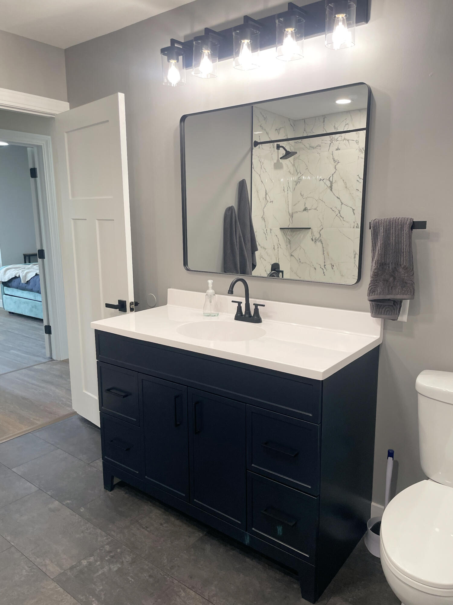 103 Michigan Street Chesterton, IN 46304 - Photo 31 of 46 a bathroom with a sink vanity mirror and toilet