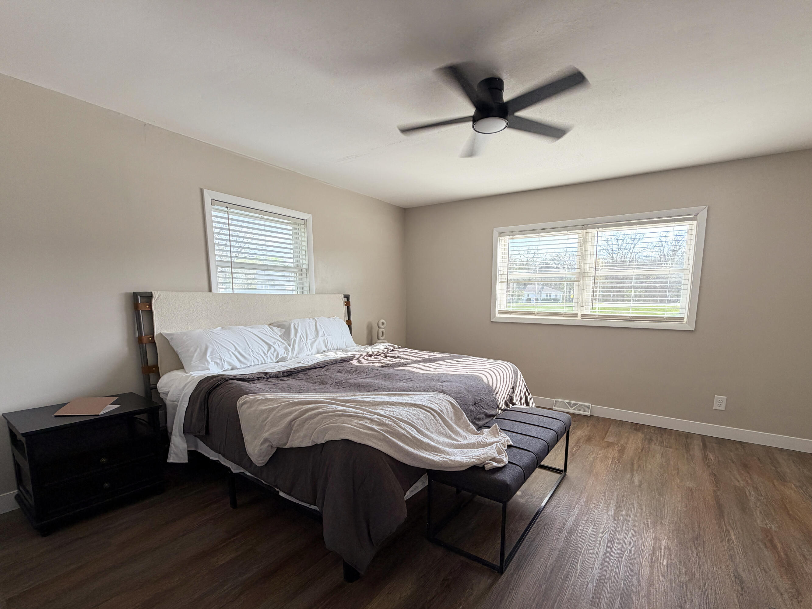 103 Michigan Street Chesterton, IN 46304 - Photo 34 of 46 a bedroom with a bed and wooden floor