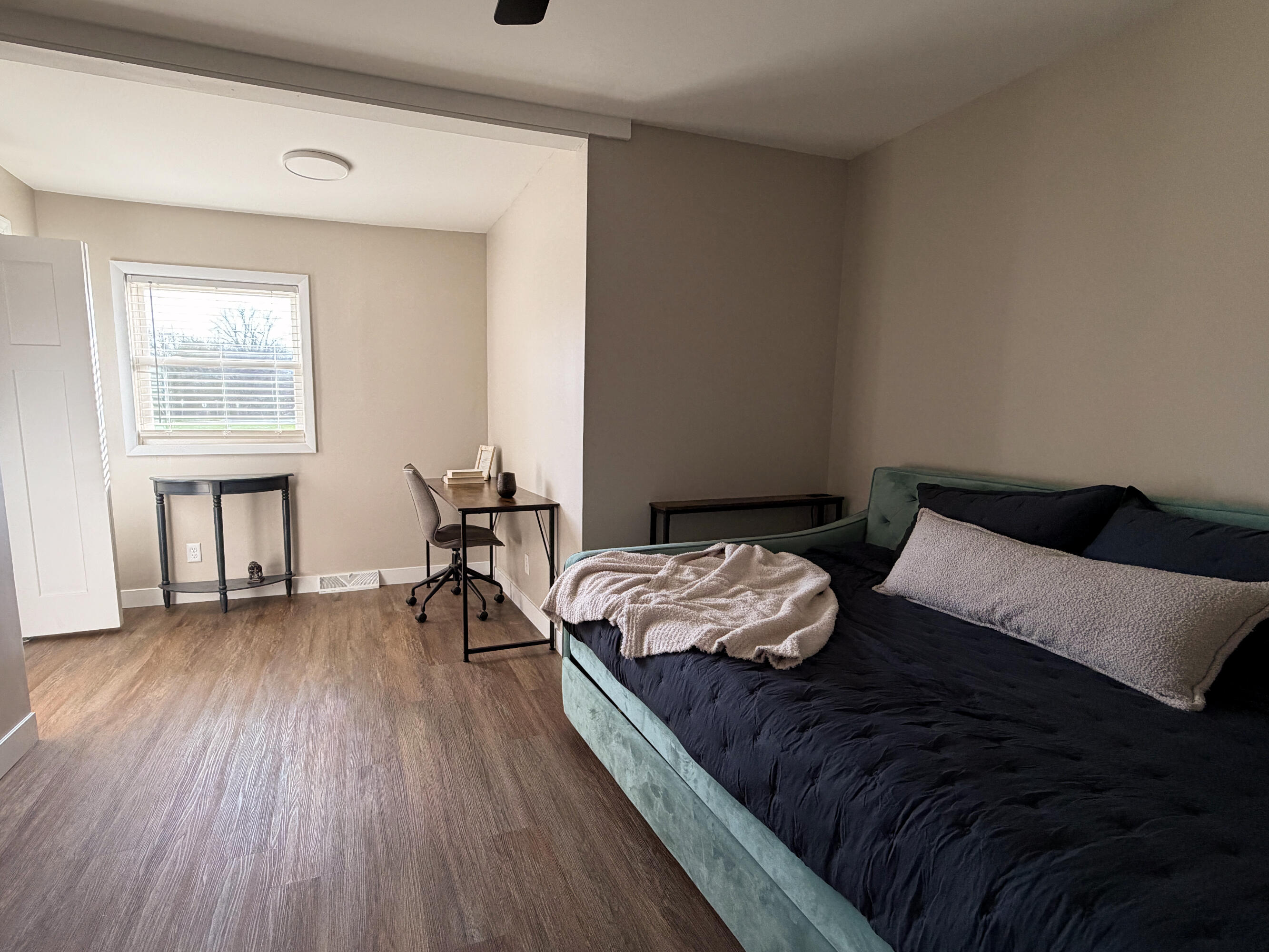 103 Michigan Street Chesterton, IN 46304 - Photo 39 of 46 a bedroom with a bed and wooden floor