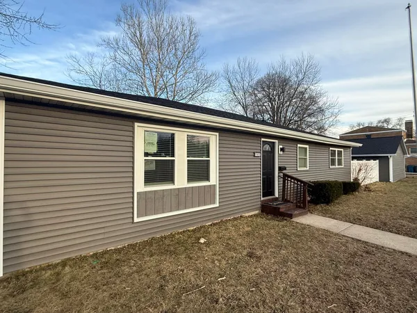 a house with trees in the background