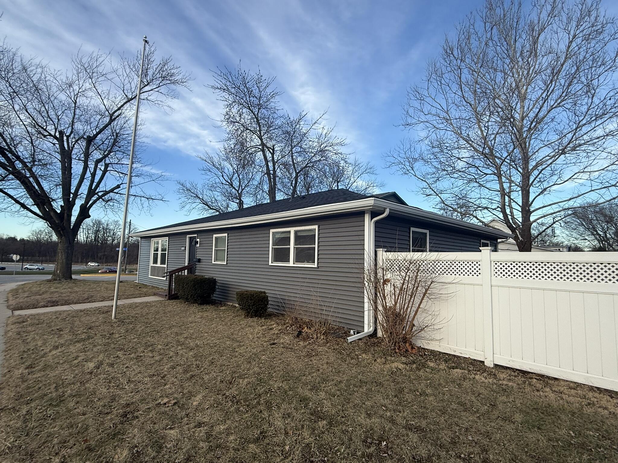 103 Michigan Street Chesterton, IN 46304 - Photo 5 of 32 a view of a small white house next to a yard