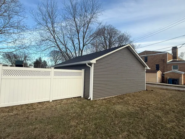 a view of garage yard and tree