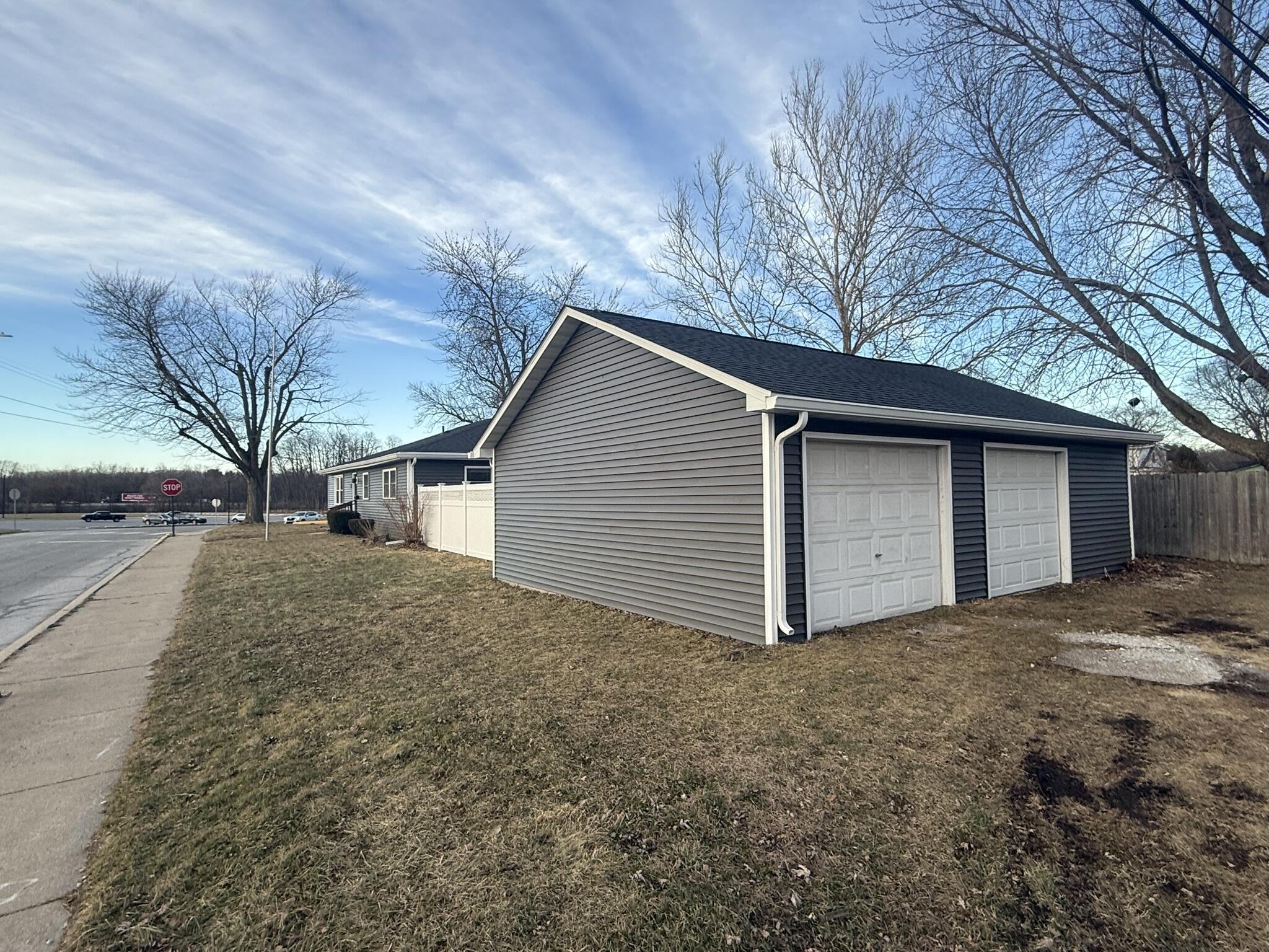 103 Michigan Street Chesterton, IN 46304 - Photo 8 of 32 a view of a house with a yard and garage