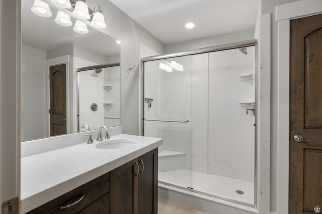 1737 East Viewside Circle Hideout, UT 84036 - Photo 22 of 35 Bathroom featuring a dark wood-finish vanity with a white countertop, undermount sink, and brushed nickel faucet