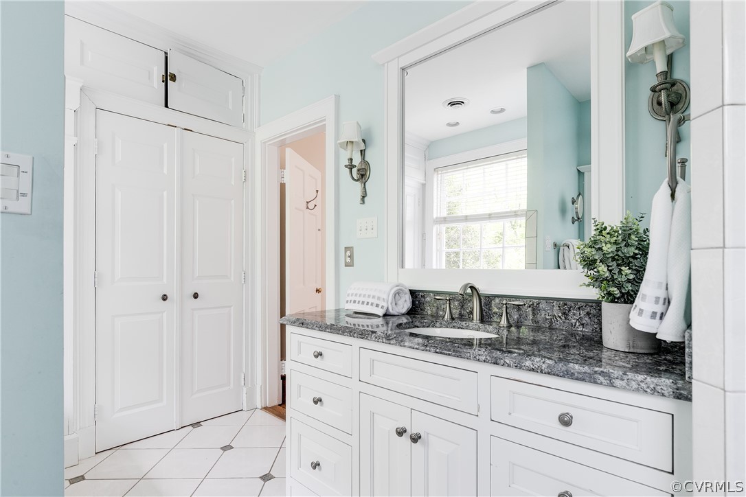 207 Nottingham Road Richmond, VA 23221 - Photo 30 of 49 a bathroom with a granite countertop sink a mirror and a shower