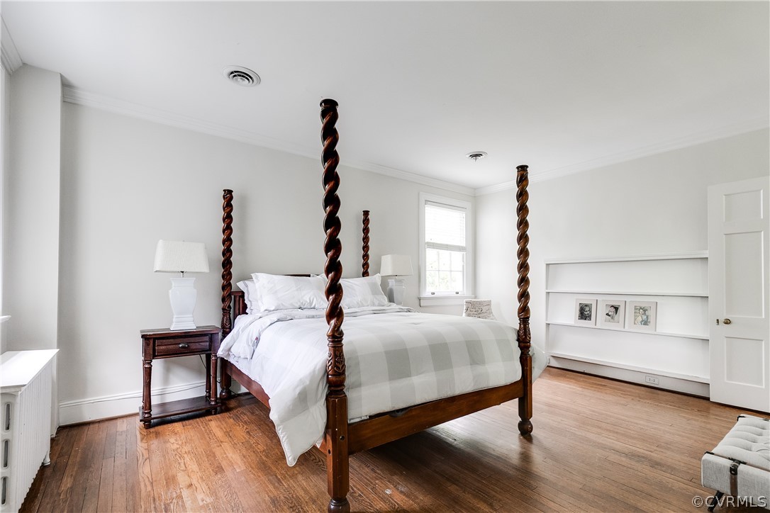 207 Nottingham Road Richmond, VA 23221 - Photo 32 of 49 a bedroom with a bed and wooden floor