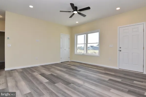 a view of balcony with wooden floor