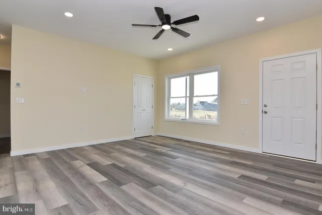 a view of balcony with wooden floor