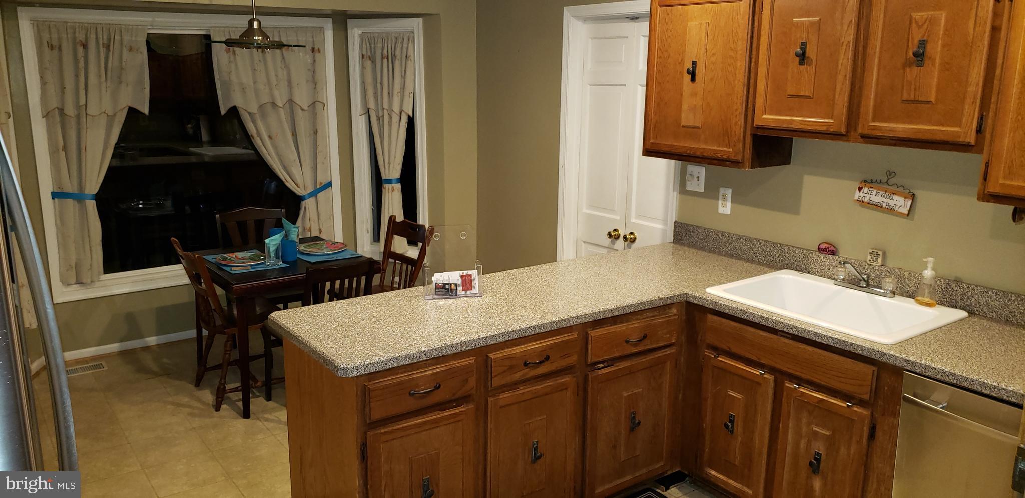 9233 Rockefeller Lane Springfield, VA 22153 - Photo 8 of 30 Kitchen with oak cabinets