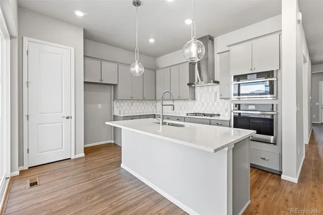 a view of a kitchen with a sink and cabinets