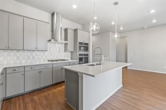 a kitchen with a sink and stove