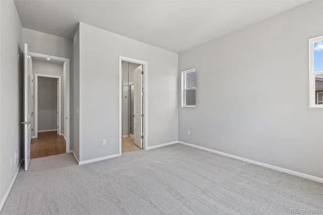 a view of an empty room and fire place