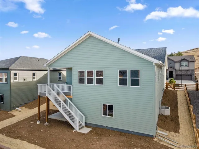 a view of an entryway with wooden floor and door