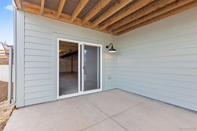 a view of balcony with wooden floor