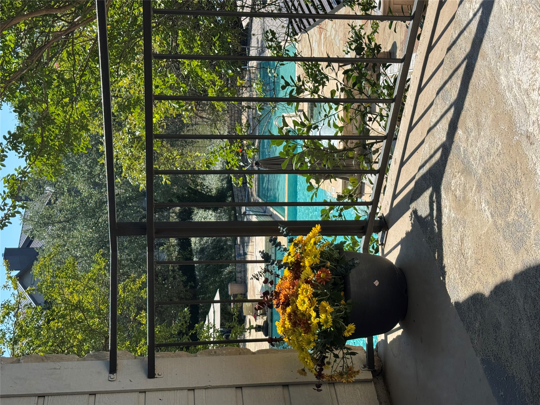 Terrace featuring view of pool area
