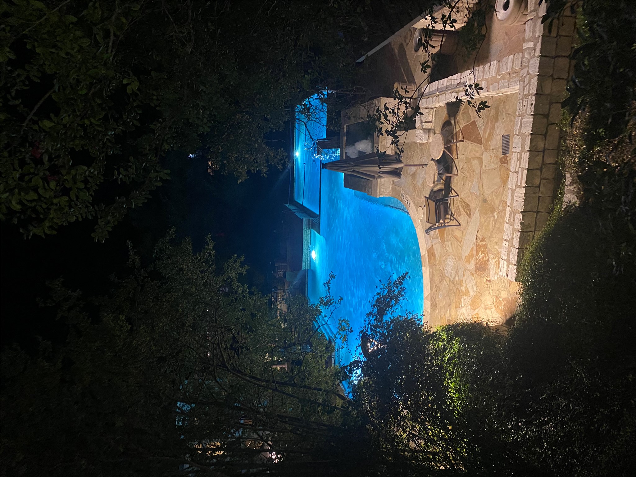 6000 Shepherd Mountain Cove, Unit 807 Austin, TX 78730 - Photo 32 of 38 Pool in the evening from the patio.