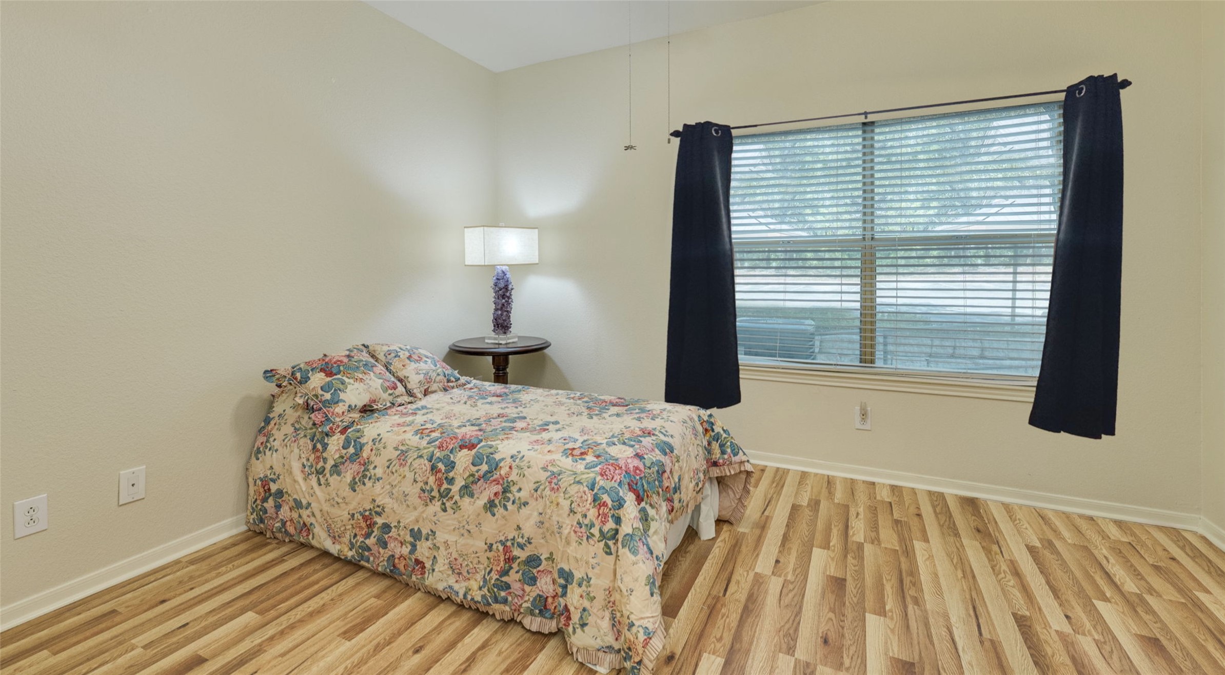 6000 Shepherd Mountain Cove, Unit 807 Austin, TX 78730 - Photo 37 of 38 Bedroom with baseboards and light wood-style floors