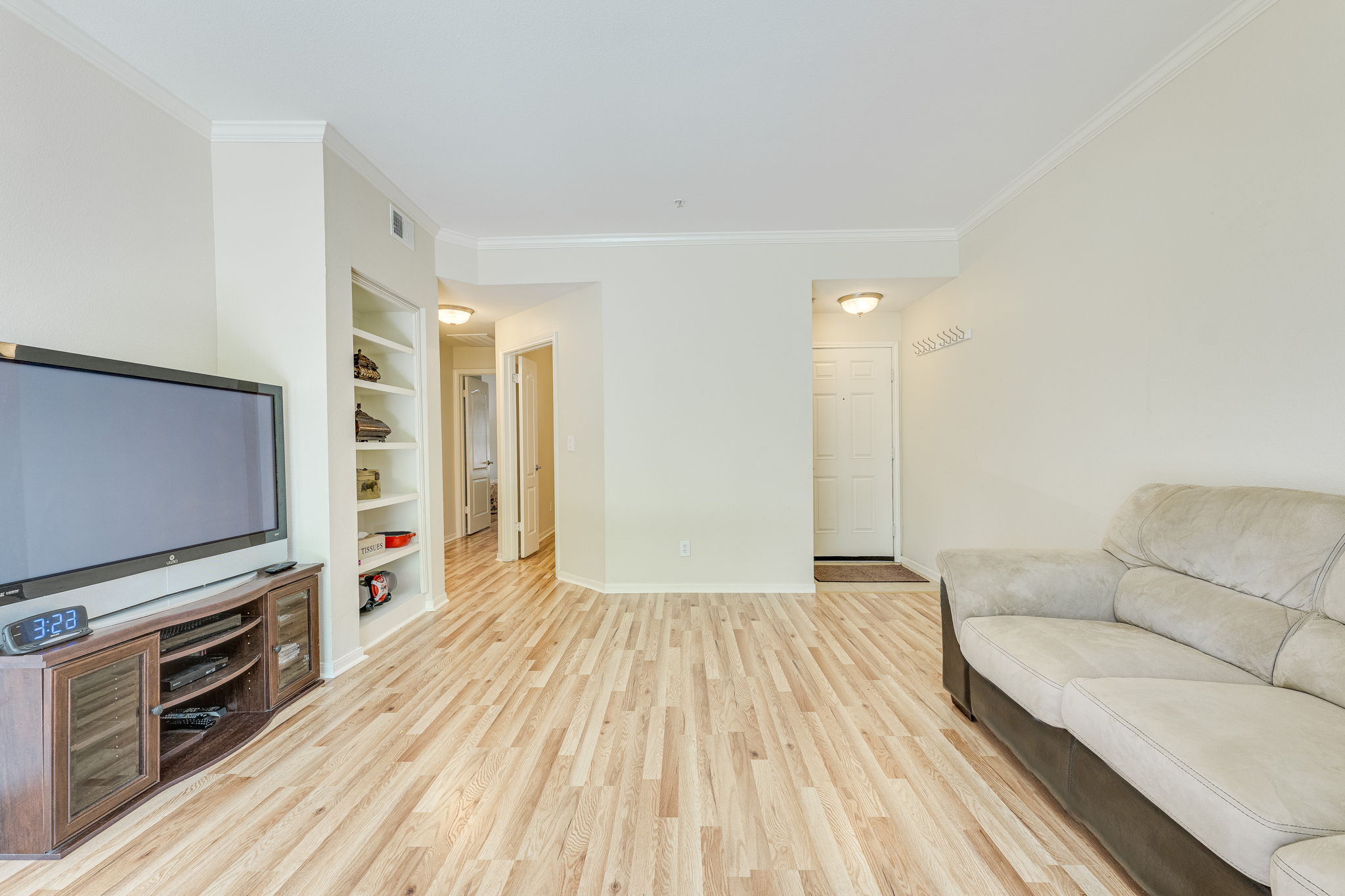 6000 Shepherd Mountain Cove, Unit 807 Austin, TX 78730 - Photo 6 of 38 Living area with new wood laminate flooring looking into bedrooms/bathroom direction.