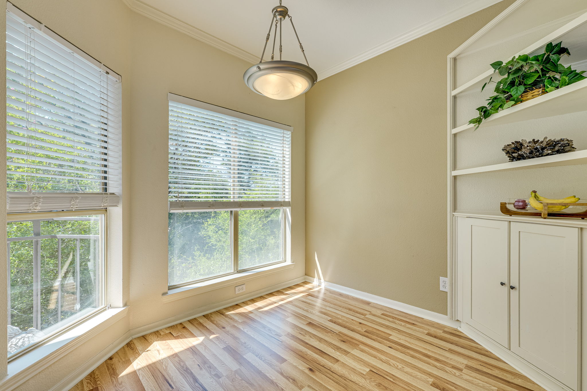 6000 Shepherd Mountain Cove, Unit 807 Austin, TX 78730 - Photo 9 of 38 Unfurnished dining area with new wood laminate floors.