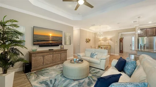 a living room with furniture and a large window with outer view