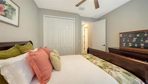 a view of a patio with a table and chairs under an umbrella